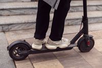 man-riding-his-electric-scooter-outdoors